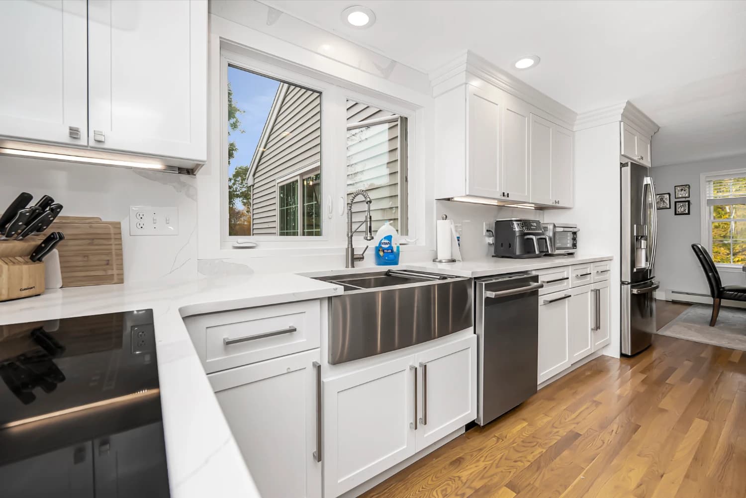 stainless steal sink with white modern kitchen features