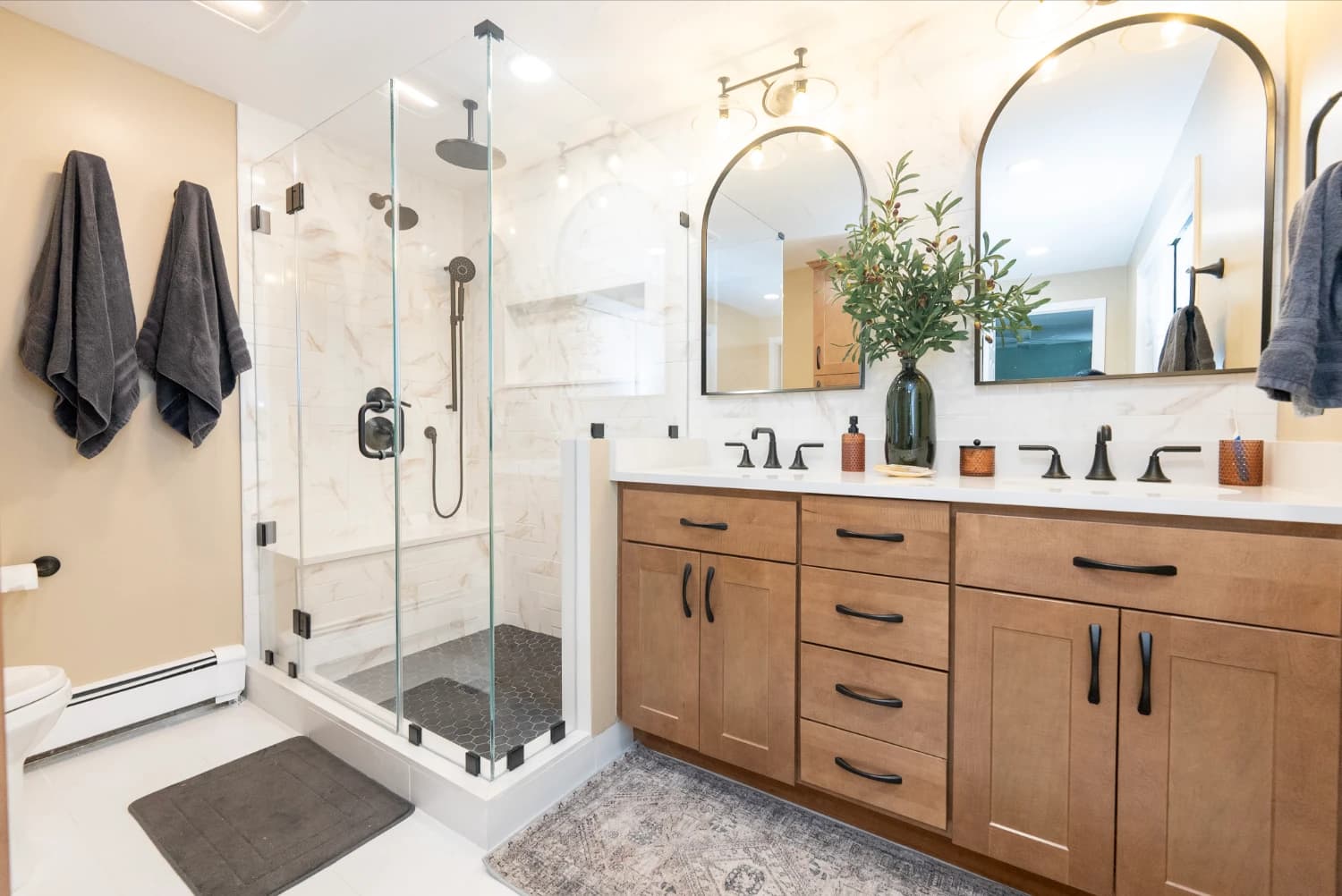 modern bathroom remodel with wooden vanity and white tile